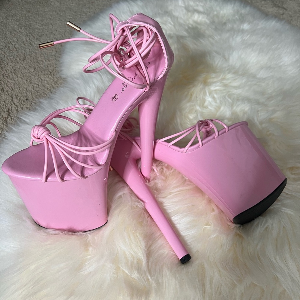Never worn. Lace up platform heels.